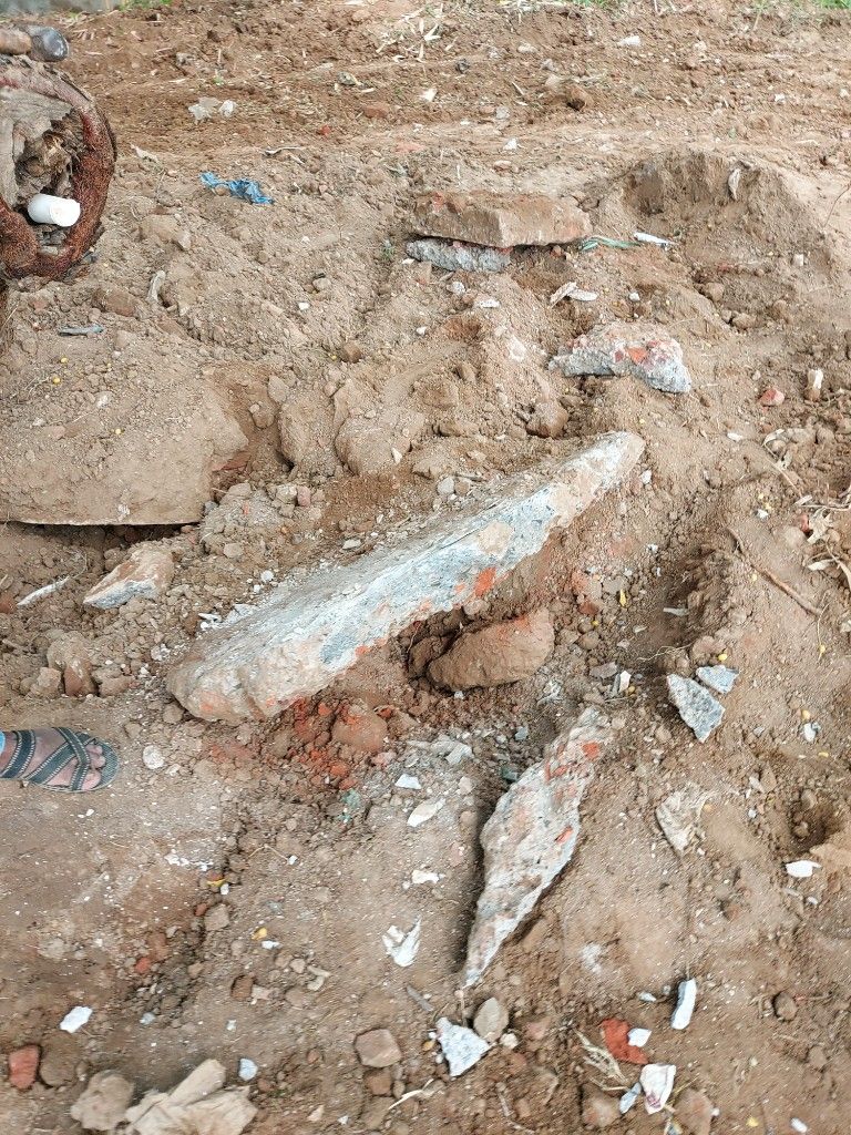 Waste dumping — construction debris and rubble across the site